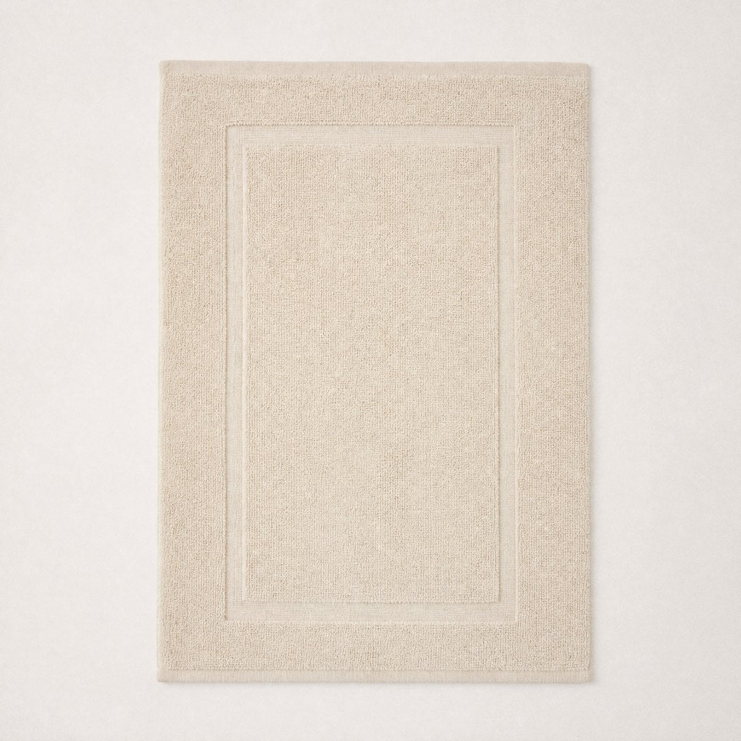 Cotton bath mat laid flat (Sand)