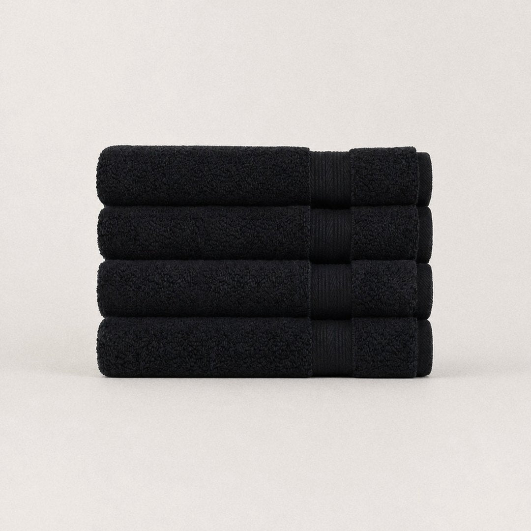 Four folded Ultrasoft bath towels (Midnight Black)