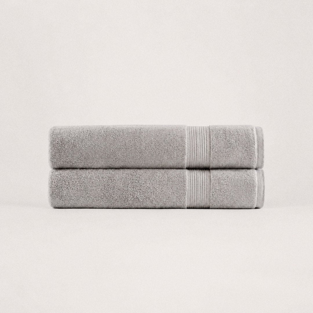 Two folded Ultrasoft bath towels (Stone Grey)