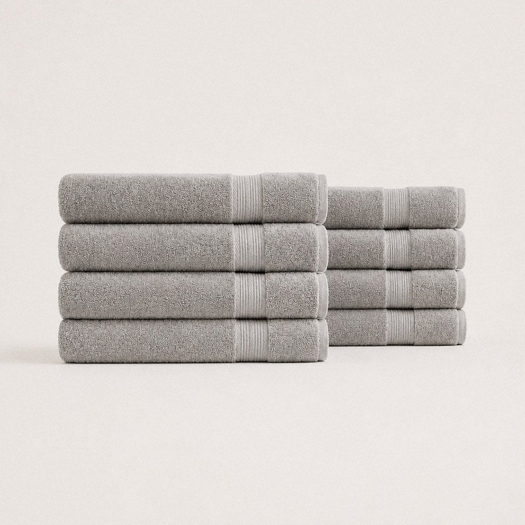 Eight folded Ultrasoft bath towels (Stone Grey)