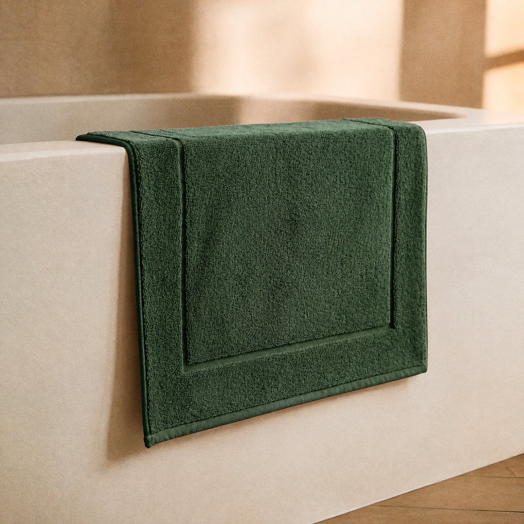 Cotton Bath Mat on the bathroom floor (Olive Green)