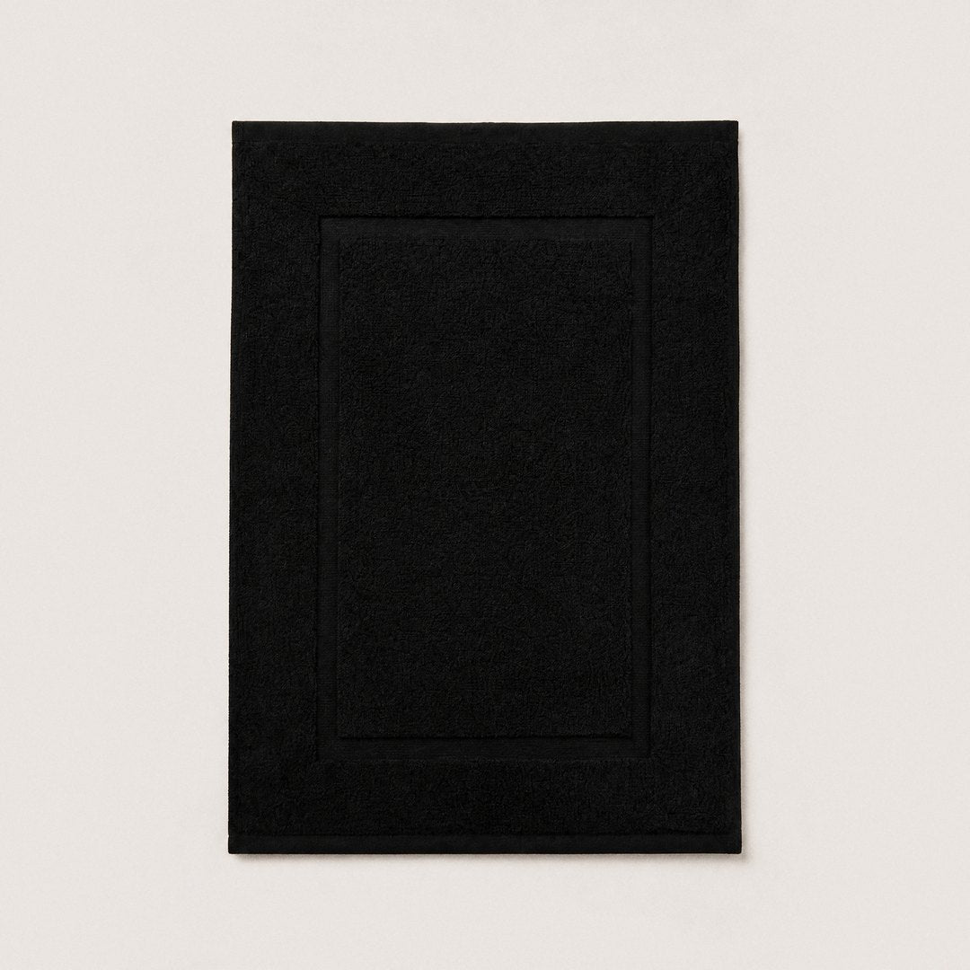 Cotton bath mat laid flat (Midnight Black)