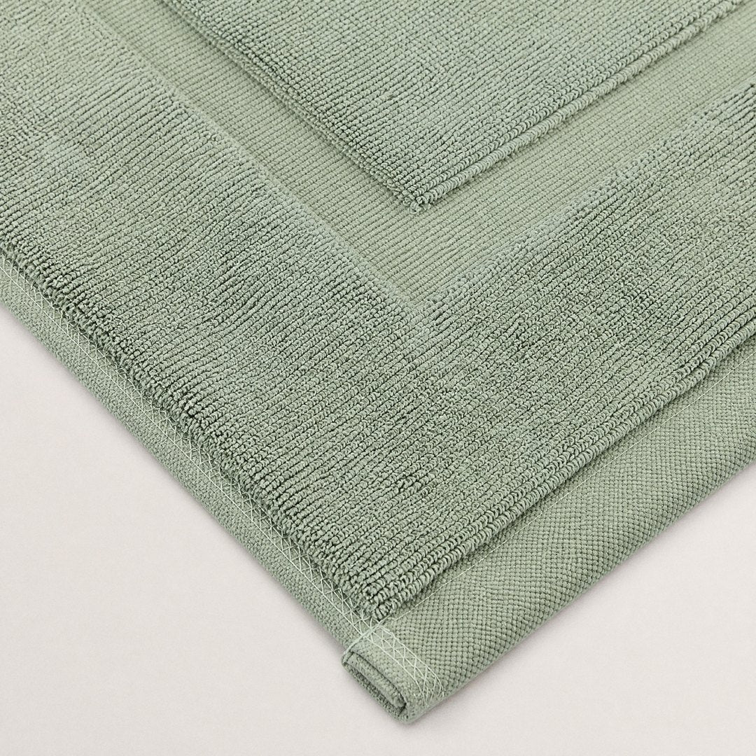 Bath mat corner close-up (Sage)